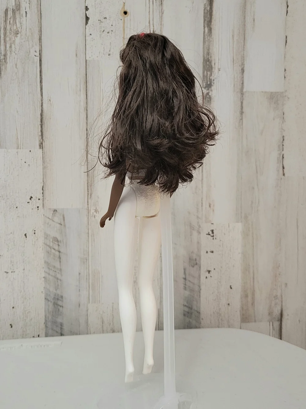 Brunette Doll with Green Stud Earrings and White Turtleneck
